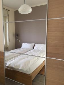 a bedroom with a bed with a glass wall at Casa Claudia in Assenza di Brenzone