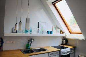 Kuchyňa alebo kuchynka v ubytovaní Rozmaring Apartman Pécs