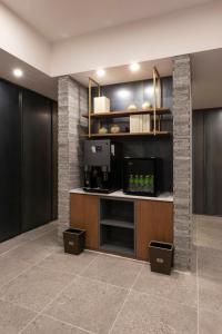 a kitchen with aasteryasteryasteryasteryasteryasteryasteryasteryasteryasteryasteryastery at Brown-Dot Hotel Gupo in Busan
