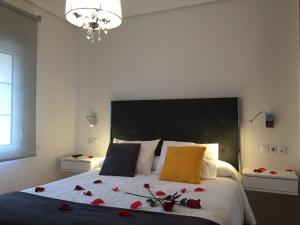 Una cama o camas en una habitación de Liencres Apartamentos