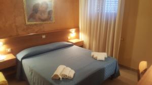 Postel nebo postele na pokoji v ubytování Hotel Il Vulcano