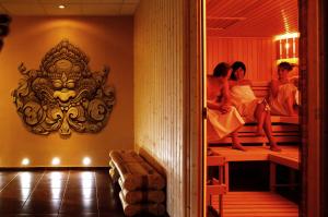 a group of people sitting on bunk beds in a room at Asian Zen in Místek