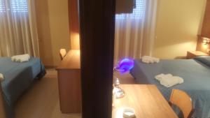 Postel nebo postele na pokoji v ubytování Hotel Il Vulcano