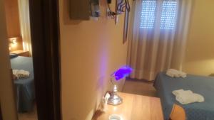Postel nebo postele na pokoji v ubytování Hotel Il Vulcano