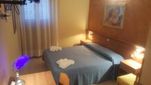 Postel nebo postele na pokoji v ubytování Hotel Il Vulcano