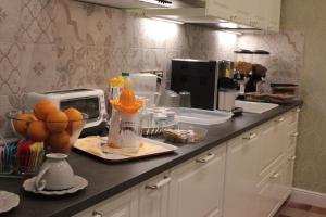 A kitchen or kitchenette at Aitna B&B