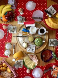 a table topped with plates of food and fruit at Casa de férias Josefa D´Óbidos in Óbidos +20 photos