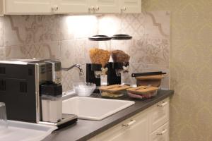 A kitchen or kitchenette at Aitna B&B