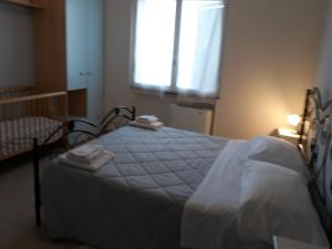 Postel nebo postele na pokoji v ubytování Il Rifugio dell'Ape Agriturismo