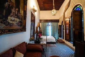 Postel nebo postele na pokoji v ubytování Riad Arabesque & Spa