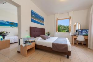 Postel nebo postele na pokoji v ubytování Hotel La Pace + 35 fotografií