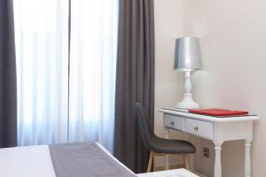 Postel nebo postele na pokoji v ubytování Hotel Carlos V