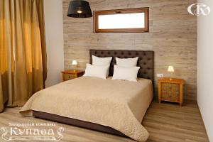 Ένα ή περισσότερα κρεβάτια σε δωμάτιο στο Hotel Complex Kupava +93 φωτογραφίες