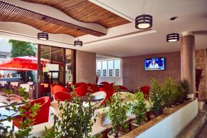 TV a/nebo společenská místnost v ubytování Hotel Olimpic