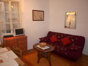 a living room with a couch and a table at Apartment 11 in Rovinj