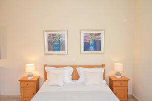 A bed or beds in a room at West Crete Chania - Villa Europa