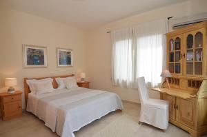 A bed or beds in a room at West Crete Chania - Villa Europa
