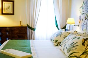 Postel nebo postele na pokoji v ubytování Hotel Villa Cimbrone