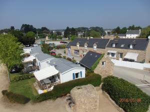 an aerial view of a house and a street at Camping les Palmiers in La Trinité-sur-Mer