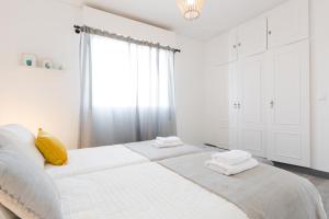 Posteľ alebo postele v izbe v ubytovaní Hola Málaga Premium Centro