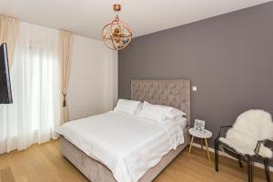 Postel nebo postele na pokoji v ubytování Perla Apartmani Split