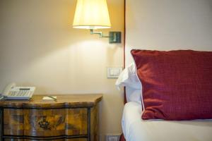 Postel nebo postele na pokoji v ubytování Hotel Villa Cimbrone