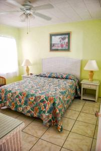 Ένα ή περισσότερα κρεβάτια σε δωμάτιο στο Atlantic Sands Beach Suites