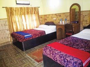 Cama o camas de una habitación en Rainbow Safari Resort