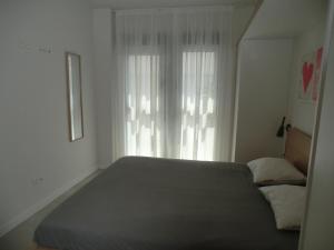Łóżko lub łóżka w pokoju w obiekcie Casas Holiday - El Mirador de Villamartin