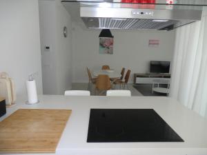 Telewizja i/lub zestaw kina domowego w obiekcie Casas Holiday - El Mirador de Villamartin