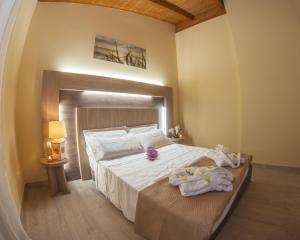 Кровать или кровати в номере Cataleya Resort & Spa