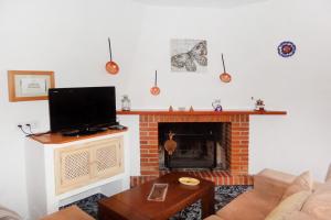 Telewizja i/lub zestaw kina domowego w obiekcie Cortijo Luque