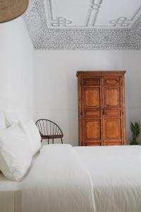 Un pat sau paturi într-o cameră la Numa Marrakech