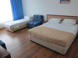 Postel nebo postele na pokoji v ubytování Albatros 2 Family Hotel