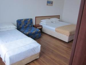 Postel nebo postele na pokoji v ubytování Albatros 2 Family Hotel