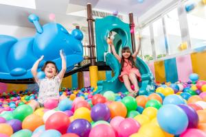 two young girls playing in a playground filled with balls at Radisson Resort & Spa Hua Hin in Cha Am +116 photos