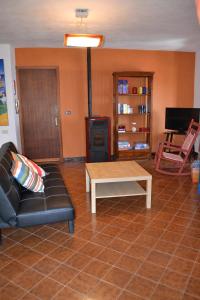 Televízia a/alebo spoločenská miestnosť v ubytovaní Casa Panoramica Castelverde
