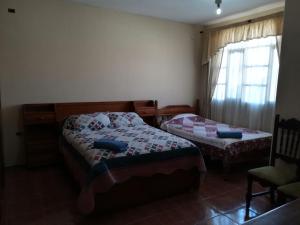 Voodi või voodid majutusasutuse Apartamento Golden toas
