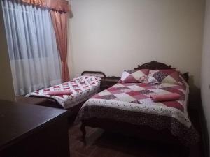 Voodi või voodid majutusasutuse Apartamento Golden toas