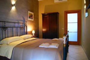 Ένα ή περισσότερα κρεβάτια σε δωμάτιο στο Oleaster - Bolognetta