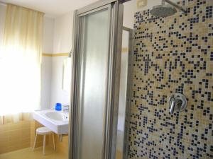 Koupelna v ubytování Elba Hotel