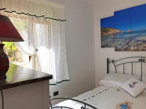 A bed or beds in a room at Villetta Azzurra
