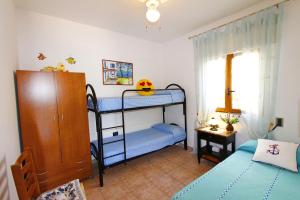 A bed or beds in a room at Villetta Azzurra Még 22 kép