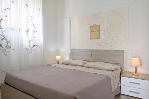Katil atau katil-katil dalam bilik di Appartamento Mariolu