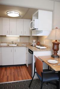 A kitchen or kitchenette at Triple J Hotel