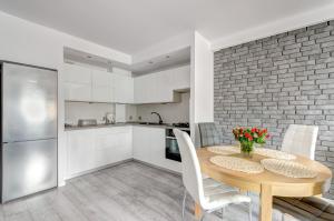 Kuchyňa alebo kuchynka v ubytovaní Prime Apartments - Skandynawski