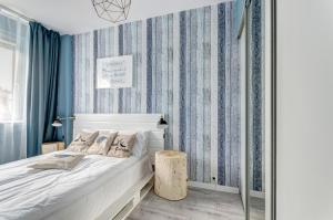 Posteľ alebo postele v izbe v ubytovaní Prime Apartments - Skandynawski