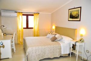 Кровать или кровати в номере Hotel Villa Fiorita