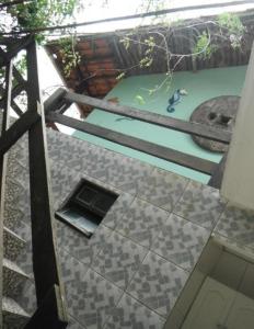 an overhead view of a stairs with a laptop on the floor at Alebelhinha Residencial Camburi Pousada in Camburi