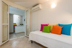 A bed or beds in a room at Apartment in S'Abba e Sa Pedra with pool